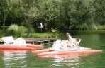 A pedal boat or pedalo for adventures on the water in the pond, in the Les Etangs du Bos leisure park